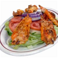 Shrimp Salad · Grilled or breaded shrimp, lettuce, tomato, cucumbers, onions & dressing.