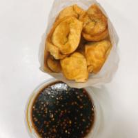 5. Pan Fried Wontons with Garlic Sauce · 10 pieces. Hot and spicy.