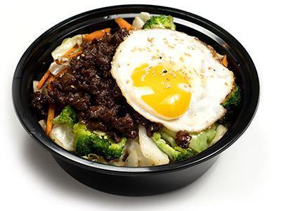 Beef Bibimbap · Variety of healthy vegetable with marinated slice beef and served with rice and spicy sauce alongside.