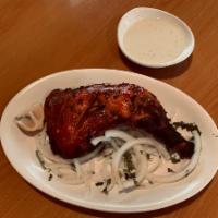 Chicken Tandoori · Roasted chicken marinated in yogurt and lemon juice and spices. 