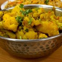 Aloo Gobhi · Potatoes and cauliflower cooked with fresh ginger, onion and tomatoes. 