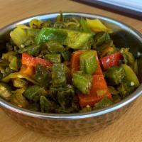 Bhindi Masala · Fresh okra cooked in onions, tomatoes, herbs and spices. 