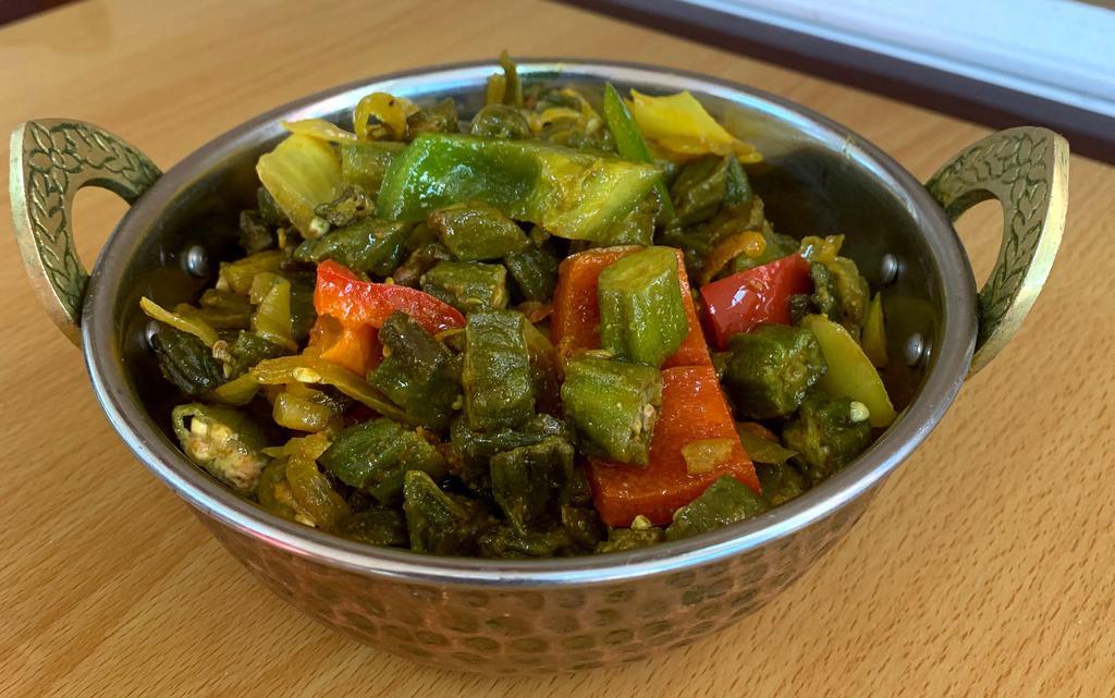 Bhindi Masala · Fresh okra cooked in onions, tomatoes, herbs and spices. 