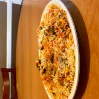 Chicken Biriyani · Spiced chicken and nuts cooked in herbs and spices with basmati rice. 