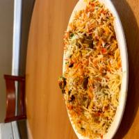 Mutton Biriyani · Spiced mutton and nuts cooked in herbs and spices with basmati rice. 