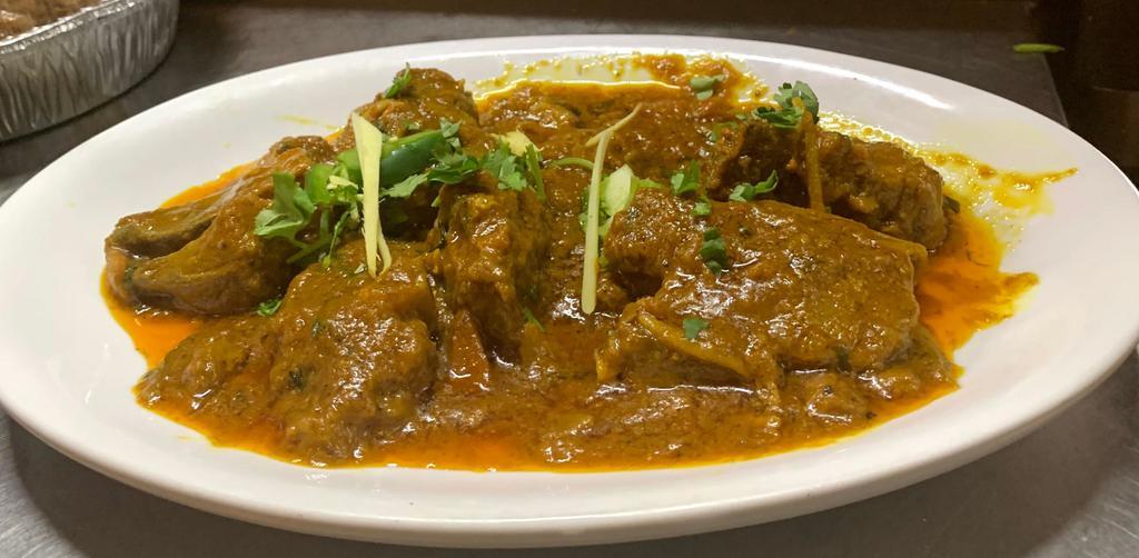 1 lb. Goat Karahi · Pieces of goat cooked with fresh tomato, bell peppers, onions and herb. 
