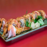 8 Piece Tiger Roll · Top crabmeat, inside shrimp tempura and mango.