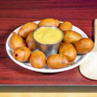 Mini Corn Dogs · Mini franks dipped in a sweet cornmeal batter and fried to perfection.