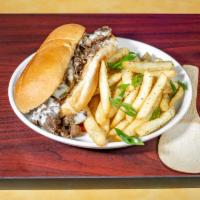 Philly Cheesesteak Sandwich · Thinly sliced, hand trimmed sirloin grilled to perfection with peppers, onions and smothered...