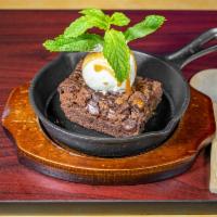 Brownie a la Mode · Hot gooey brownie topped with ice cream, chocolate and caramel sauce.