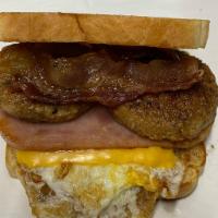 LEANDER TOAST · EGG, BACON, SAUSAGE, HAM & CHEESE