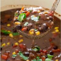 Spicy Black Bean Soup · A blend of seasoned black beans chipotle peppers green peppers yellow onions jalapeños fire ...