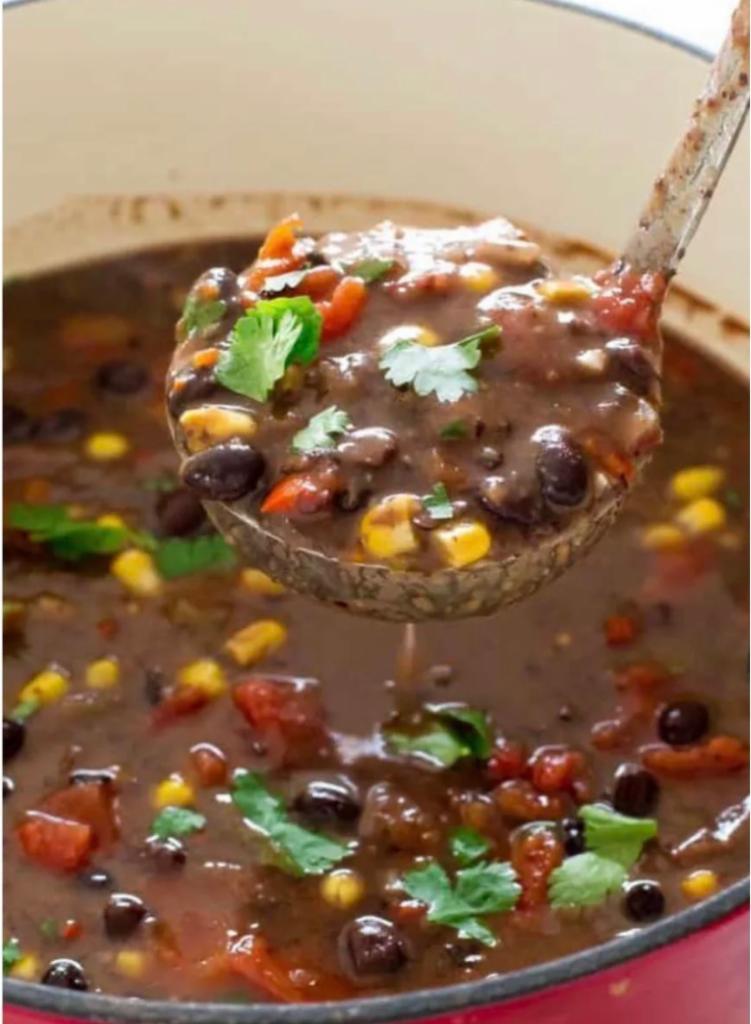 Spicy Black Bean Soup · A blend of seasoned black beans chipotle peppers green peppers yellow onions jalapeños fire roasted tomatoes red onions and rice in a vegetable broth with seasonings. Its a meal in a cup!