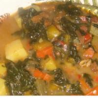 Pepper Pot Soup · A delicious blend of 4 greens peppers red potatoes sweet potatoes carrots and noodles.