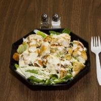 Oven Roasted Chicken Caesar Salad · Green salad with Caesar dressing, oven roasted chicken and cheese. Extra dressing for an add...