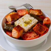 Horiatiki Salad (Greek Salad) · Greek salad with romaine lettuce, tomatoes, cucumbers, red onions, olives, dolmadakia and fe...