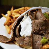 Gyro Sandwich · Vertically roasted spiced minced beef and lamb. Served on pita with lettuce, tomato, onion &...