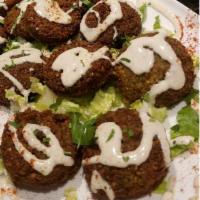 4. Falafel · 5 pieces. Chickpeas, parsley, onion and spices. Vegetarian.