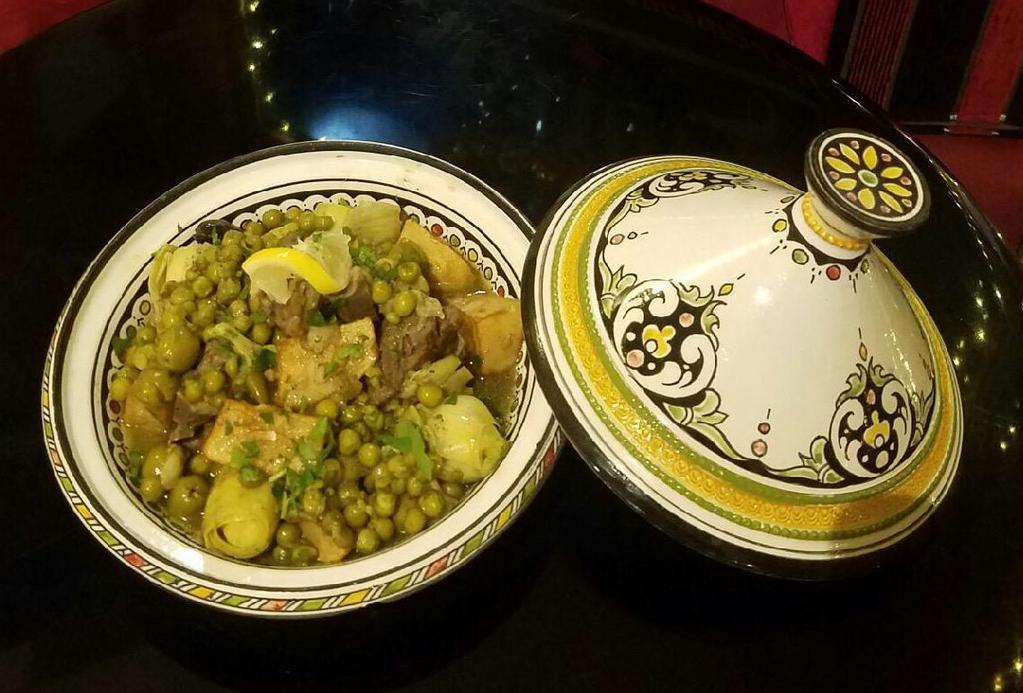 2. Lamb Tagine · Shank of lamb, artichoke, sweet peas, potato and olives simmered with a bouquet of herbs and spices.
