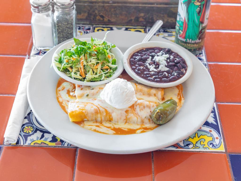 Chicken Enchiladas Suizas · Chile verde sauce, cheese, and sour cream. Served with black beans.
