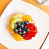 Fruit Tart · A pie crust base filled with custard and topped with Kiwi, Strawberries, blueberries, and ma...