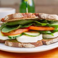 Very Veggie Sandwich · fresh mozzarella, tomato, cucumber, spinach, pesto, garlic  aioli, olive oil 
