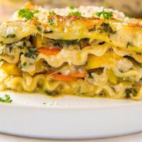 Lasagna - Veggie · Layers of pasta, fresh cut vegetables, mascarpone cream sauce held together with fresh shred...