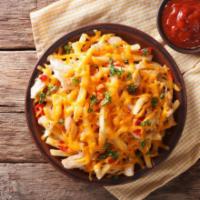 Chili Cheese Fries · Fresh golden fries with warm chili topped on it.
