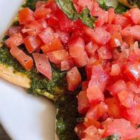 Bruschetta · Grilled ciabatta bread with pesto spread, marinated diced tomatoes, and fresh basil.