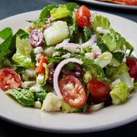 Greek Salad · romaine lettuce, kalamata olives, feta cheese, cucumbers, bell peppers, sweet red onions, to...