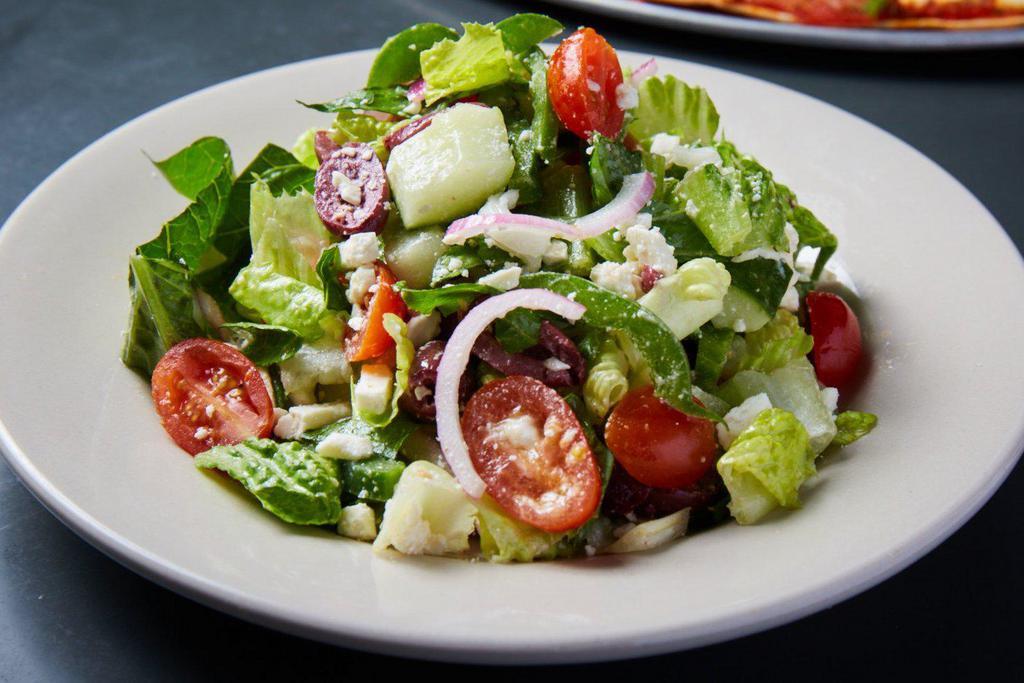 Greek Salad · romaine lettuce, kalamata olives, feta cheese, cucumbers, bell peppers, sweet red onions, tomatoes with olive oil, and white balsamic vinegar