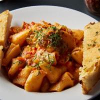 Rigatoni in Bolognese Sauce · Rigatoni tossed in a traditional bolognese sauce with ground sirloin, diced vegetables, topp...