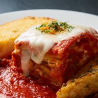 Meat Lasagna · Homemade meat lasagna layered with ground sirloin, fresh mozzarella, parmesan, pomodoro sauc...
