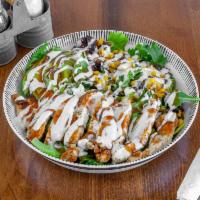 BBQ Southwest Chicken Salad · Romaine hearts, mixed greens, roasted corn salsa tortilla strips, avocado, grilled chicken t...