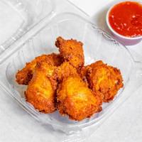 5 Piece Buffalo Chicken Wings · Cooked wings of a chicken coated in Buffalo sauce. 