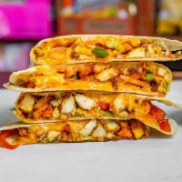 The Spicy Quesadilla · Buffalo chicken, pepper Jack cheese, onion, bell pepper, jalapeno and sour cream.