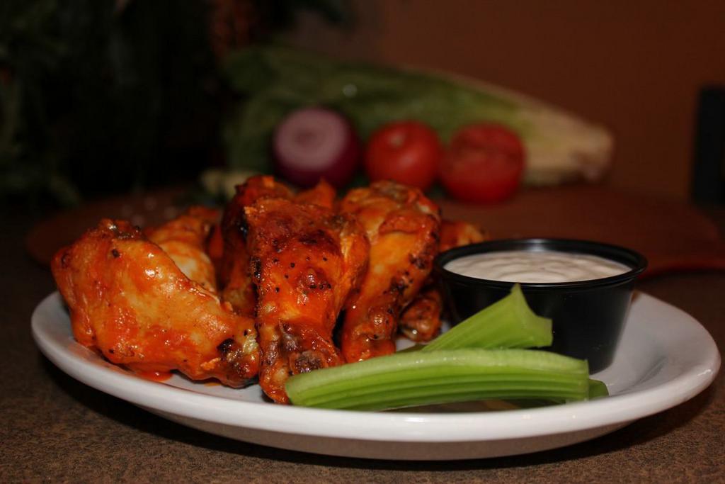 1 lb. Wings · Choose juicy brick fired wings or rib tips. Choice of ranch or blue cheese.
