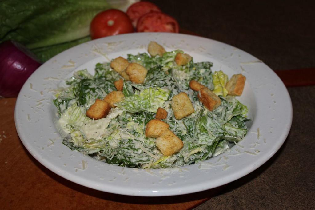 Caesar Salad · Romaine lettuce tossed with creamy Caesar dressing, gourmet 3 cheese blend and seasoned croutons.