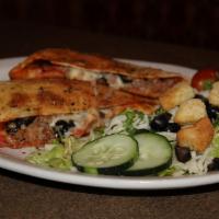 Classic Calzone · House red sauce, pepperoni, Italian sausage, black olives and mozzarella. Served with a side...