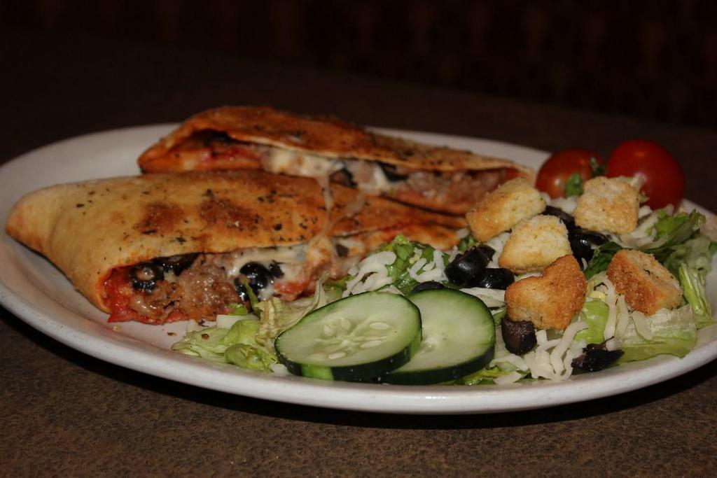 Classic Calzone · House red sauce, pepperoni, Italian sausage, black olives and mozzarella. Served with a side salad and marinara.