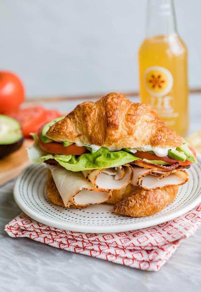 Turkey Croissant Sandwich · Premium deli turkey over a croissant with toppings.