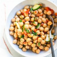 Chickpeas, Garbanzo and Tabouli Salad · Mediterranean style chickpeas made with fresh toppings and finished with lemon juice.  A hou...