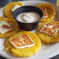 Mini-Cachapas · 5 pieces. Sweet fresh corn pancake with Venezuelan cheese.