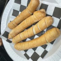 Tequeñon  · 4 large pieces. Deep fried white cheese sticks wrapping wheat flour dough.