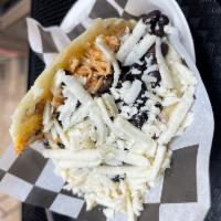 Arepa Pabellon Pollo · Shredded chicken, black beans, white cheese, and sweet plantains.