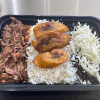 Pabellon Criollo  · Shredded beef, white rice, black beans, sweet plantains, and white cheese.