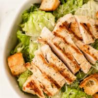 Grilled Chicken Caesar Salad · Grilled chicken over Romaine lettuce tossed with Caesar dressing, Italian breaded croutons w...