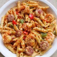 New York Signature · Grilled shrimp, chicken and sausage with penne pasta in our special Cajun Alfredo sauce with...