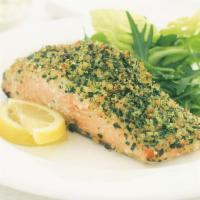 Herb Crusted Salmon Filet · Cooked to perfection, fresh salmon with a delicious lemon white wine sauce,  and lemon. Serv...