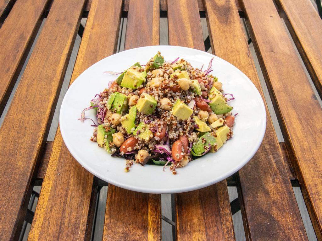 Quinoa Salad Bowl · Quinoa, farro, marinated beans, red cabbage, chickpeas, avocado, pepper, lemon, olive oil and pomegranate vinaigrette.